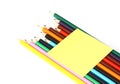 Multicolored pencils and note stick