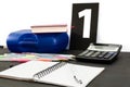 Multicolored pencils, pens, notebook, book and pictures with numbers on a black table. Education concept. Office supplies on the t Royalty Free Stock Photo