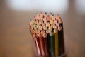 Multicolored pencils on the table. A stack of colored pencils ti Royalty Free Stock Photo