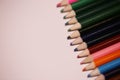 Multicolored pencils on the table. A stack of colored pencils ti Royalty Free Stock Photo