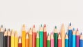 Multicolored pencils in a uneven row Royalty Free Stock Photo