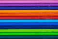 Multicolored pencils with water drops on wooden table Royalty Free Stock Photo