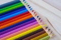 Multicolored pencils with water drops on wooden table Royalty Free Stock Photo