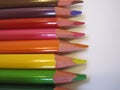 Multicolored pencils on a white paper