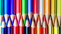 Multicolored pencils on wooden background forming a pattern with Royalty Free Stock Photo