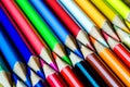 Multicolored pencils on wooden background forming a pattern with Royalty Free Stock Photo