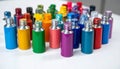 Multicolored perfume bottles with silver caps arranged on white surface Royalty Free Stock Photo