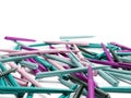 Multicolored plastic ball pens are scattered on a white background. 3D rendering