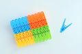 Multicolored plastic clothespins. White background. Royalty Free Stock Photo