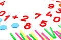 Multicolored plastic figures and numbers on a white background. Educational games for children. Math and calculation skills