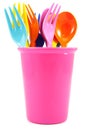multicolored plastic forks and spoons on cup Royalty Free Stock Photo