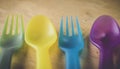 Multicolored plastic forks and spoons.environment concept idea . save earth .ban plastic