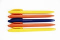 Multicolored plastic stationery pens on a white background Royalty Free Stock Photo