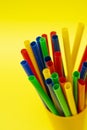 Multicolored Plastic Straws in a Yellow Container for Party Decor Royalty Free Stock Photo
