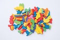 multicolored plasticine pieces puzzle on white surface