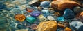 Multicolored precious beautiful stones in water. Selective focus. Royalty Free Stock Photo