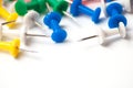 Multicolored push pins on awhite background close-up macro, place for text Royalty Free Stock Photo