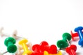 Multicolored push pins on awhite background close-up macro, place for text Royalty Free Stock Photo