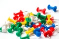 Multicolored push pins on white background close-up Royalty Free Stock Photo