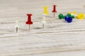 Multicolored push pins on the wooden table. Close up. Selective focus Royalty Free Stock Photo