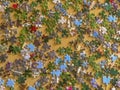 Multicolored puzzle elements on wooden table close-up. Top view. Copy space. Board games concept