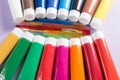 Multicolored acrylic paints tubes set with five colorful brushes