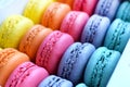 Multicolored rainbow macaroon desserts. Delicious french macaroons with filling