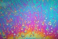 Multicolored rainbow soap bubble, psychedelic background. Abstract liquid colors and texture Royalty Free Stock Photo