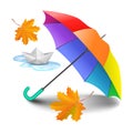 Multicolored realistic umbrella with falling yellow leaves