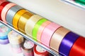 Multicolored ribbons and braid in sewing shop