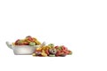 multicolored ring shaped cereals on white background.