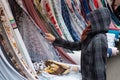 Multicolored rolls of fabrics and textiles on the market. Sale of textiles on   Turkish market in Berlin Royalty Free Stock Photo
