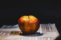 Multicolored rotten spoiled ripened apples on white background