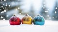 Multicolored round shiny festive Christmas balls on background of white snow