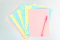 Multicolored sheets of blocks for booklet. Blank checkered pages from a folding notebook in different pastel colors scattered on