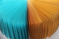 Multicolored sheets of paper for recording notes on a flat surface turquoise and yellow