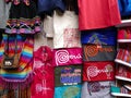 Multicolored shirts and bags for sale in Lima