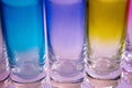 Multicolored shot glasses in a row Royalty Free Stock Photo