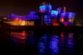 Multicolored show on the facade of the Guggenheim Bilbao museum. Royalty Free Stock Photo