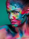Multicolored skin, difficult to identify. Creative makeup with colorful patterns on the face.