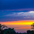 Multicolored sky over landscape at sunset Royalty Free Stock Photo
