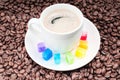 Multicolored slabs of shugar and cup of coffee Royalty Free Stock Photo