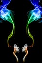 Multicolored smoke of green and blue colors on a black isolated background. Background of blurry smoke effect Royalty Free Stock Photo