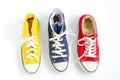 Multicolored sneakers on white background.