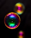 Multicolored soap bubble isolated on a black Royalty Free Stock Photo