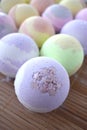 Multicolored spa bombs. Close up many bath balls on desk.