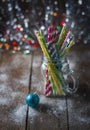 Multicolored spiral straw cocktails in a glass jar Mason on a festive New Year`s background. Sweet table. A table with a drink. Royalty Free Stock Photo