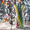 Multicolored spiral straw cocktails in a glass jar Mason on a festive New Year`s background. Sweet table. A table with a drink. Royalty Free Stock Photo