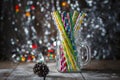 Multicolored spiral straw cocktails in a glass jar Mason on a festive New Year`s background. Sweet table. A table with a drink. Royalty Free Stock Photo