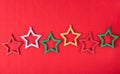 Multicolored star decorations on red